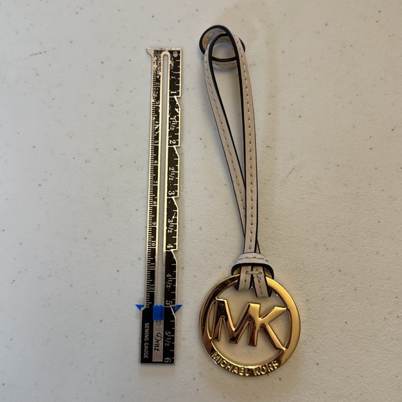 Michael Kors hang tag, gold with ivory leather strap. Approx 6” x 1.75” - Picture 3 of 5